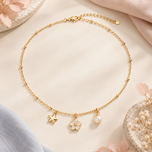 Gold-tone whimsical three-charm necklace concept